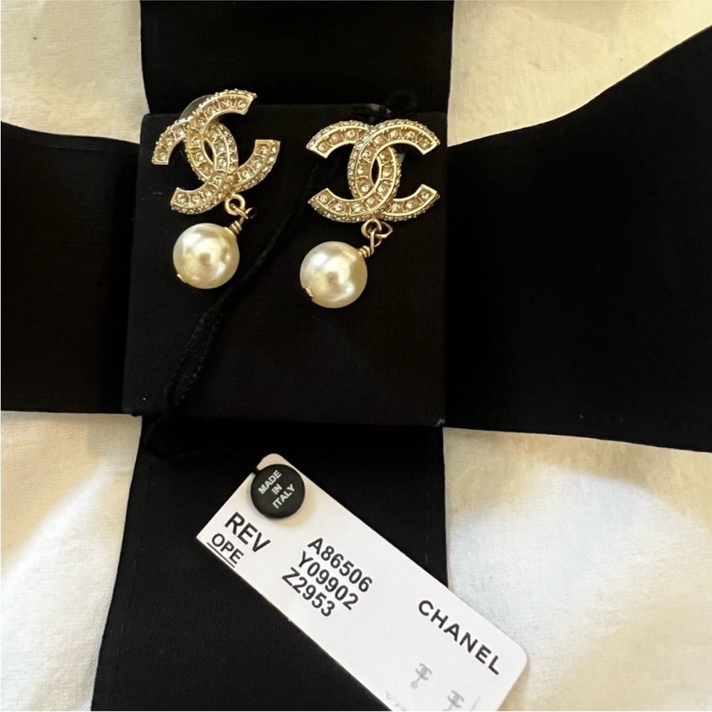 Authentic Chanel Gold and Silver Earrings with Crystal Embellishments.